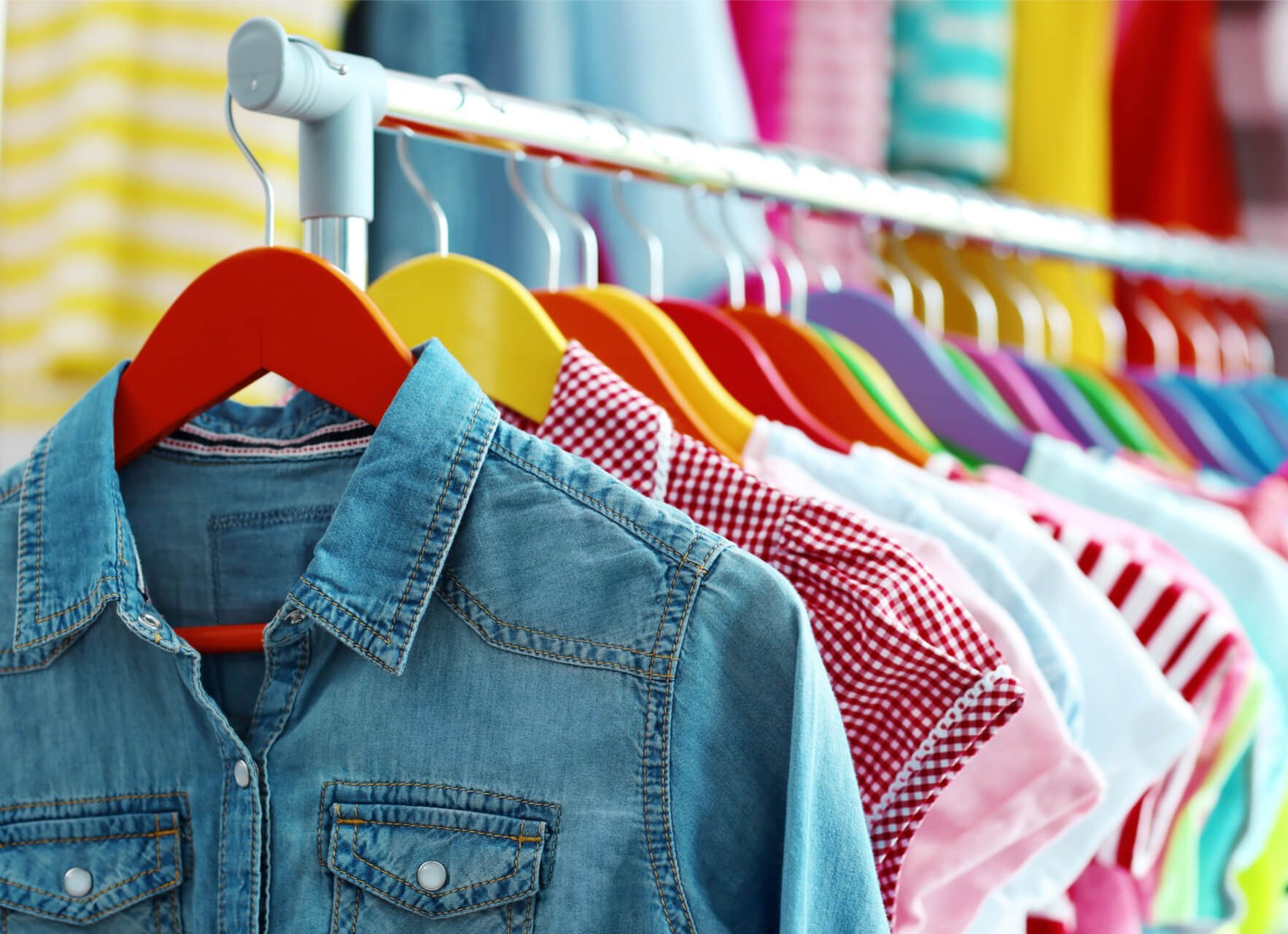children clothes hanging on hangers shop e1719044145732